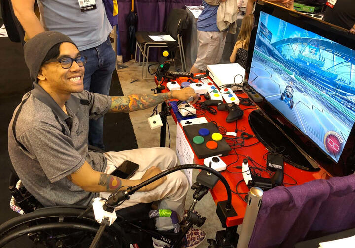 large group of people posing in a conference hall